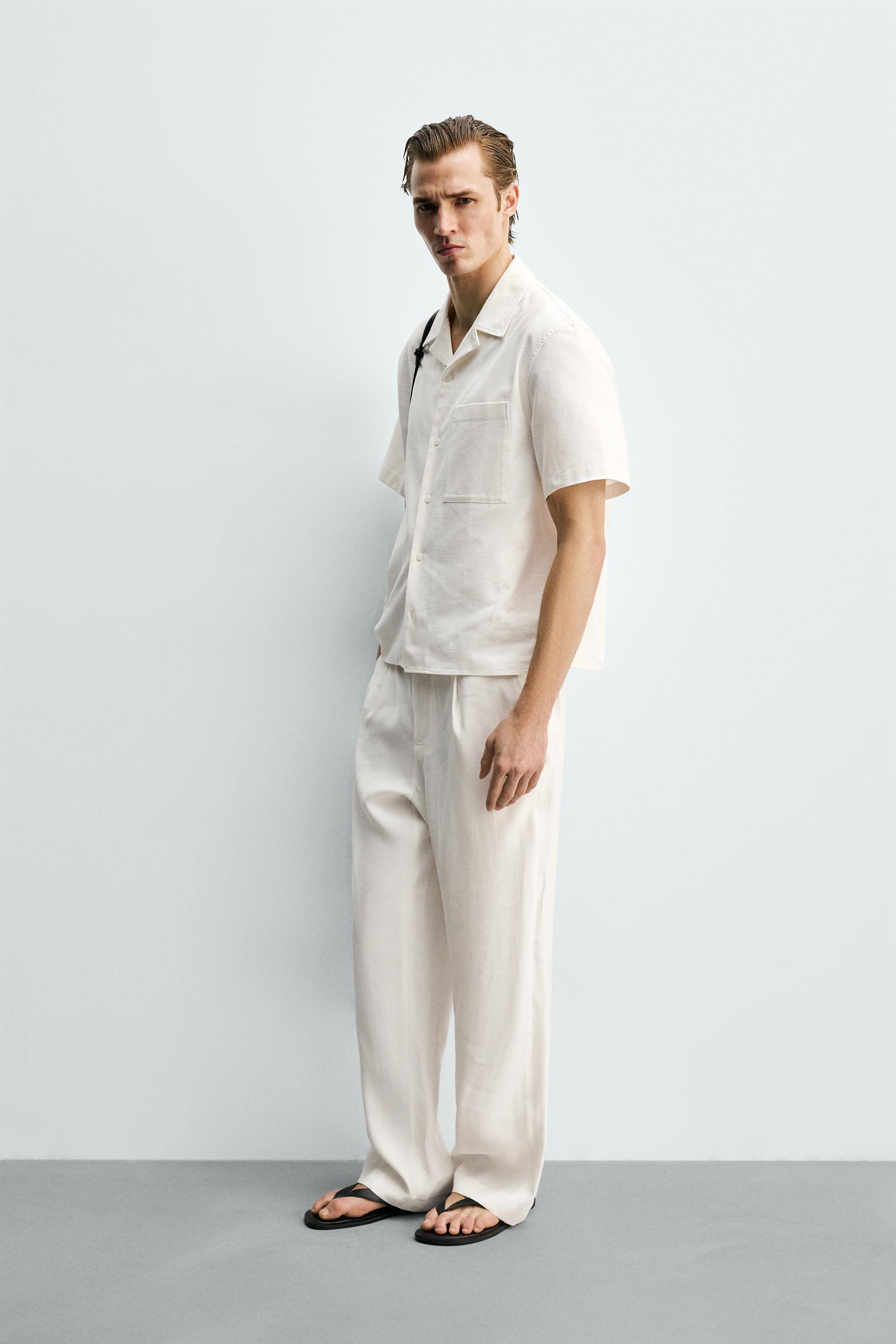 RELAXED FIT PLEATED PANTS