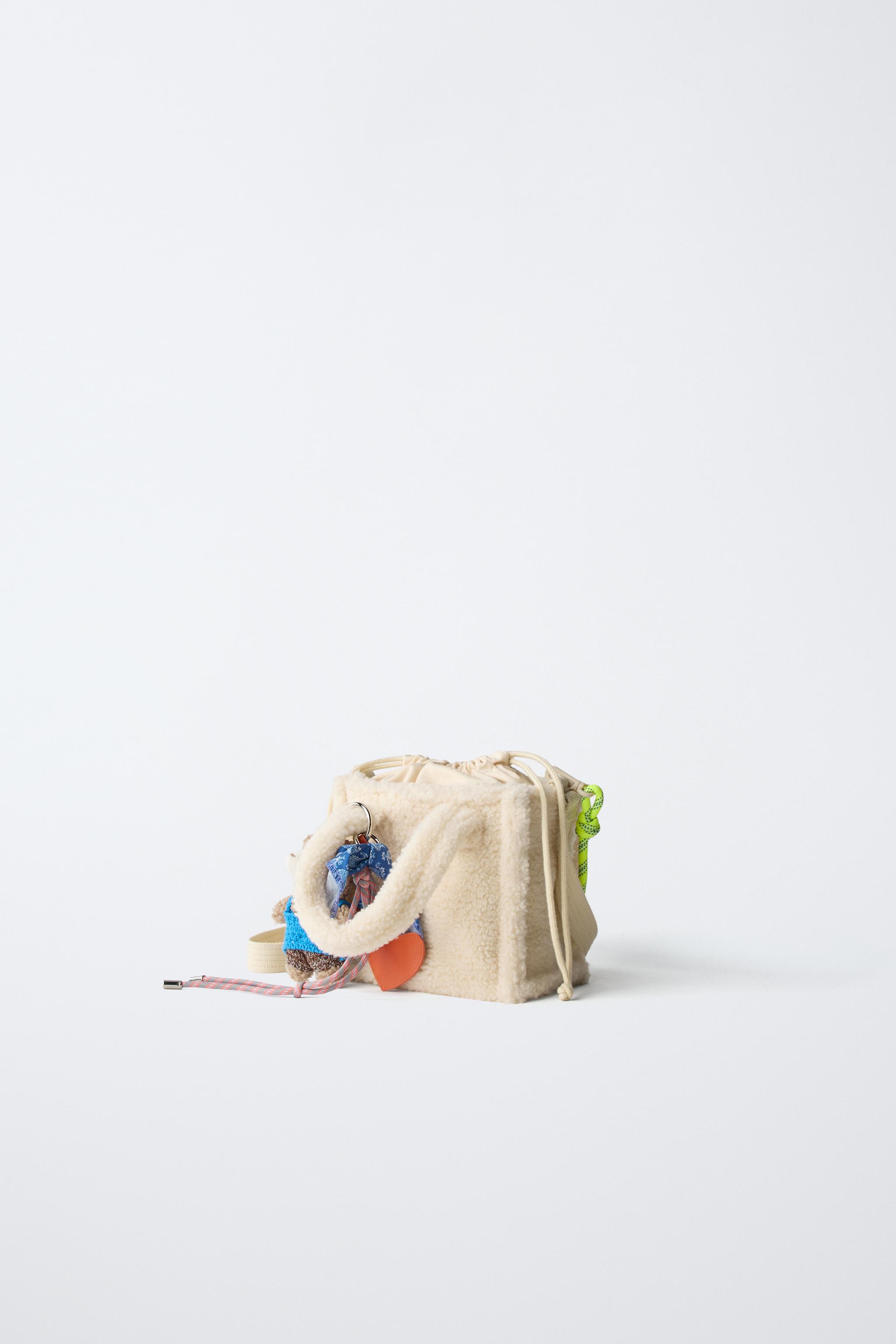 SAC BANDOULIÈRE EN PEAU DE MOUTON CHARM