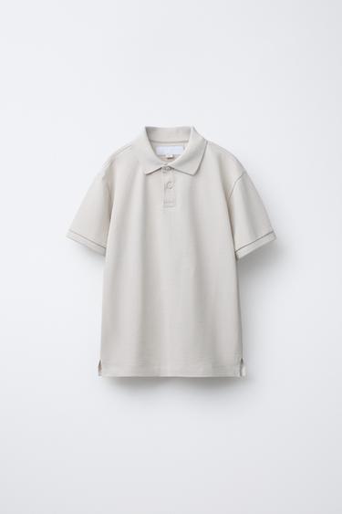 POLO BÁSICO LISO - de Zara