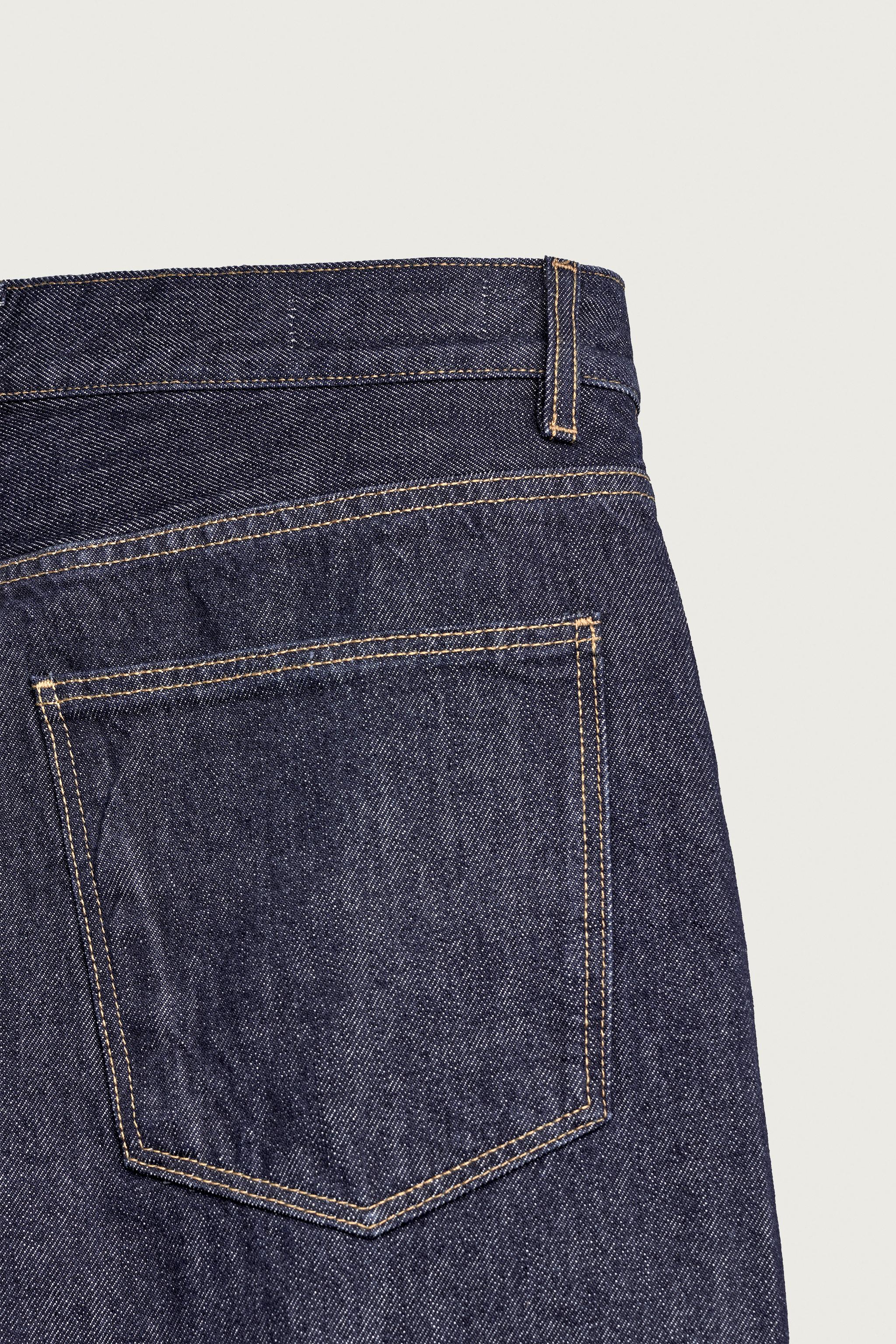 STRAIGHT-FIT JEANS WITH TWISTED SEAMS