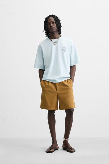 CAMISETA TEXTO ESTAMPADO - Celeste de Zara - Imagen 0