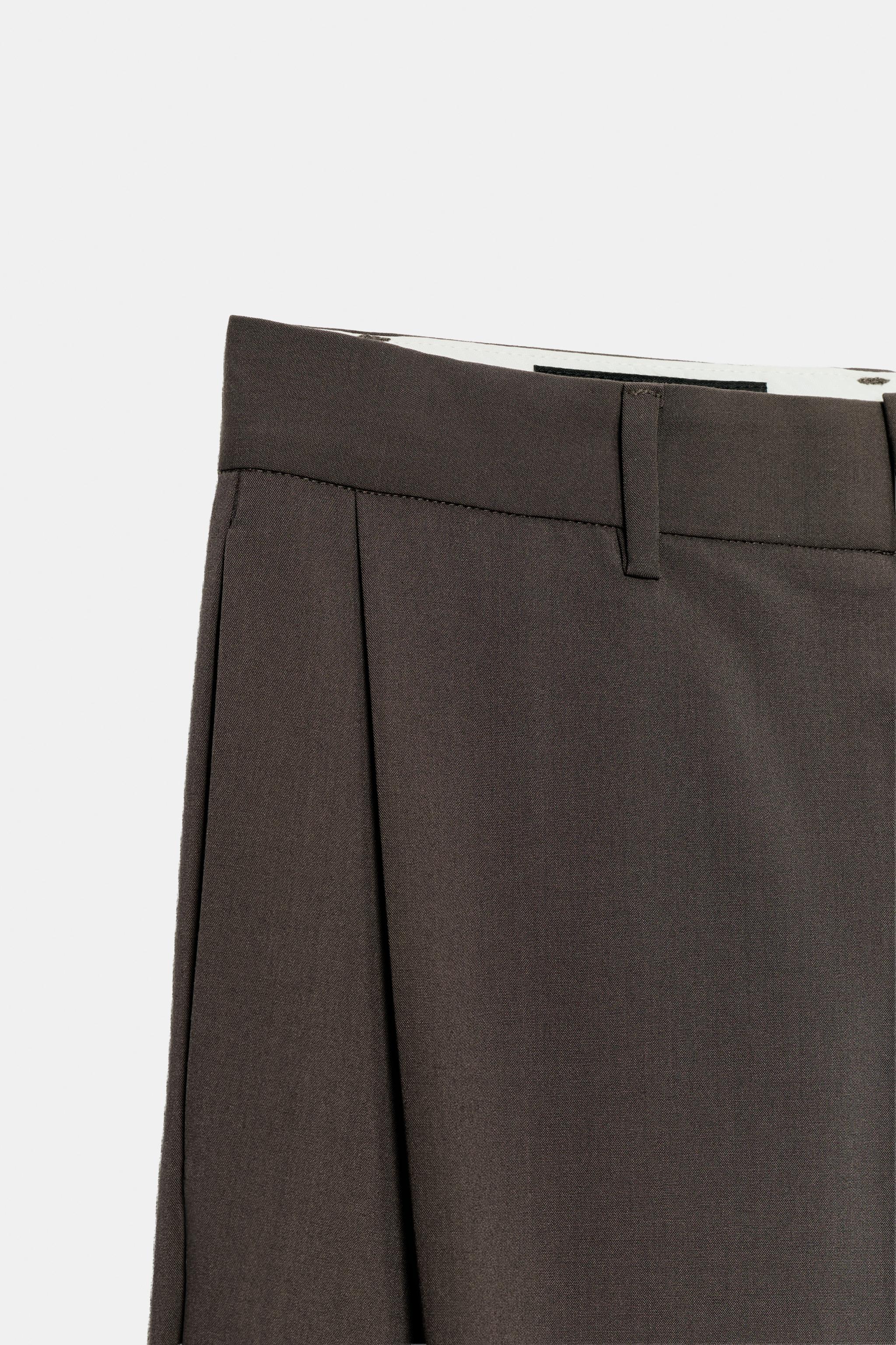 STRIPED PLEATED PANTS