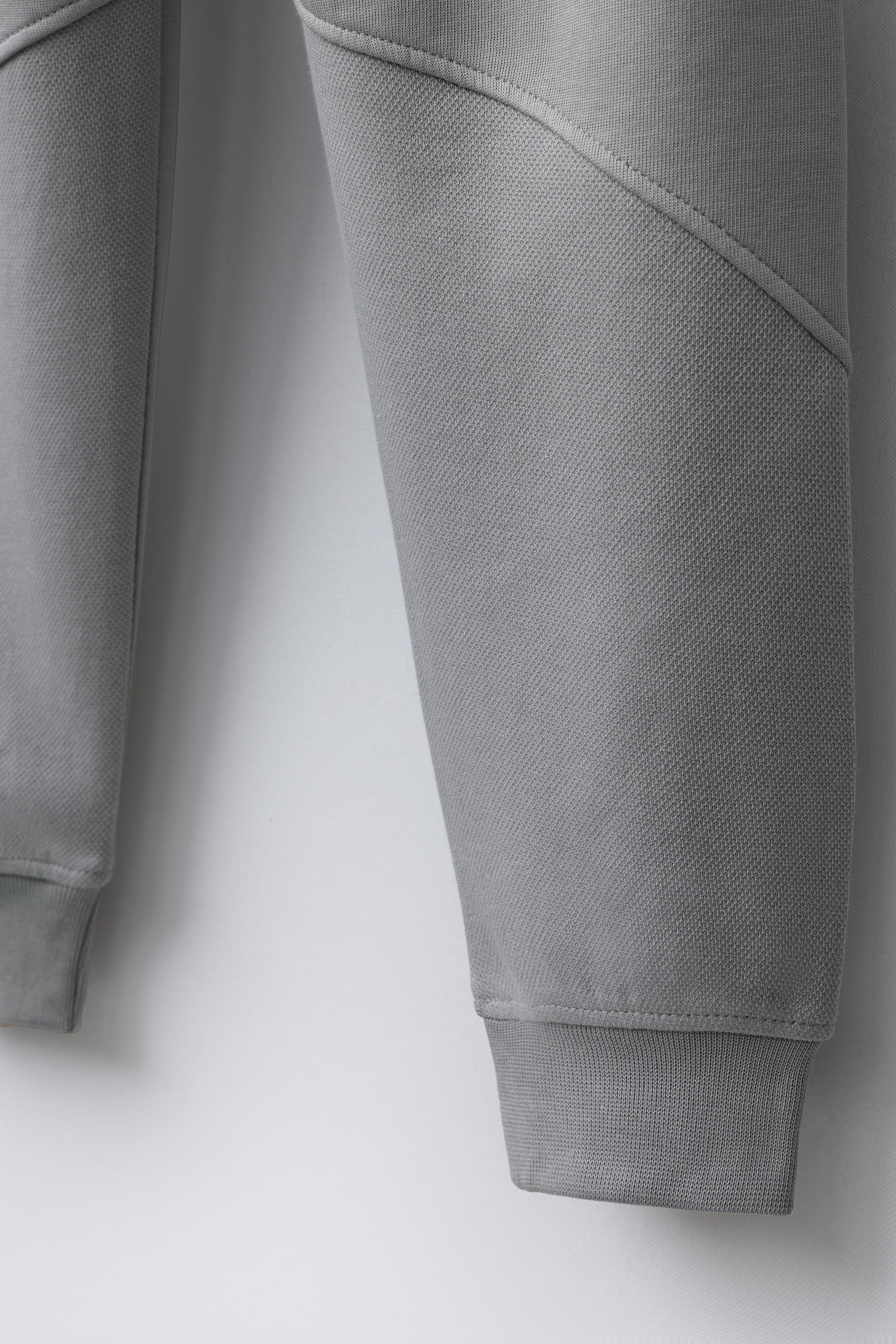 PANTALON EN MOLLETON INTERLOCK ET PIQUÉ