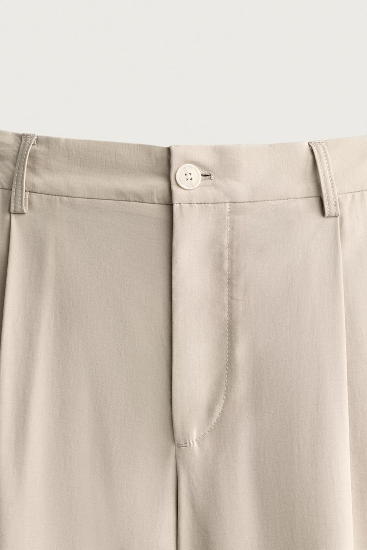Pantalones con pliegues corte relajado 4