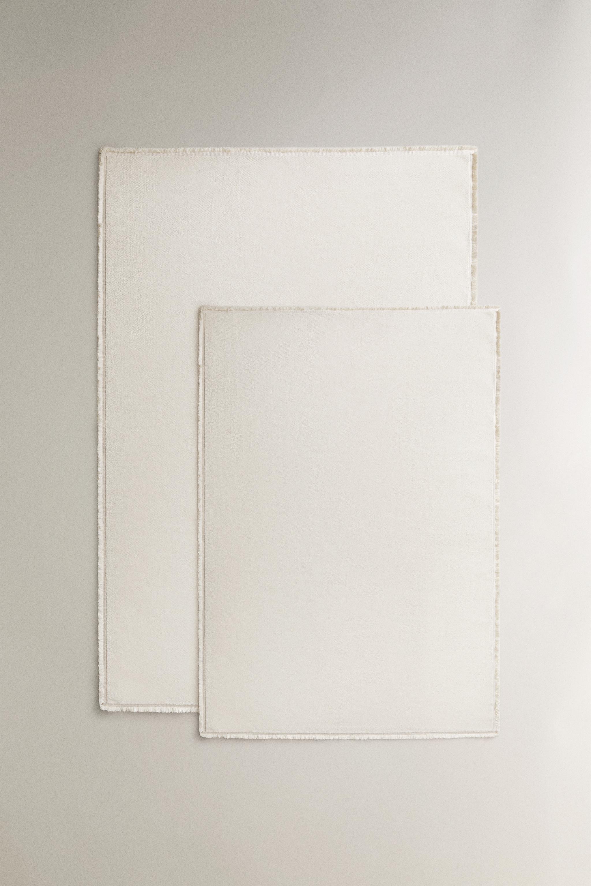 FRINGED AREA RUG — Oyster-white