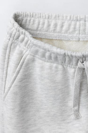 PANTALON EN MOLLETON À JAMBES LARGES ÉTOILES - Gris chiné de Zara - Image 2