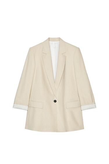 Front view of a beige blazer with lapel and front pockets