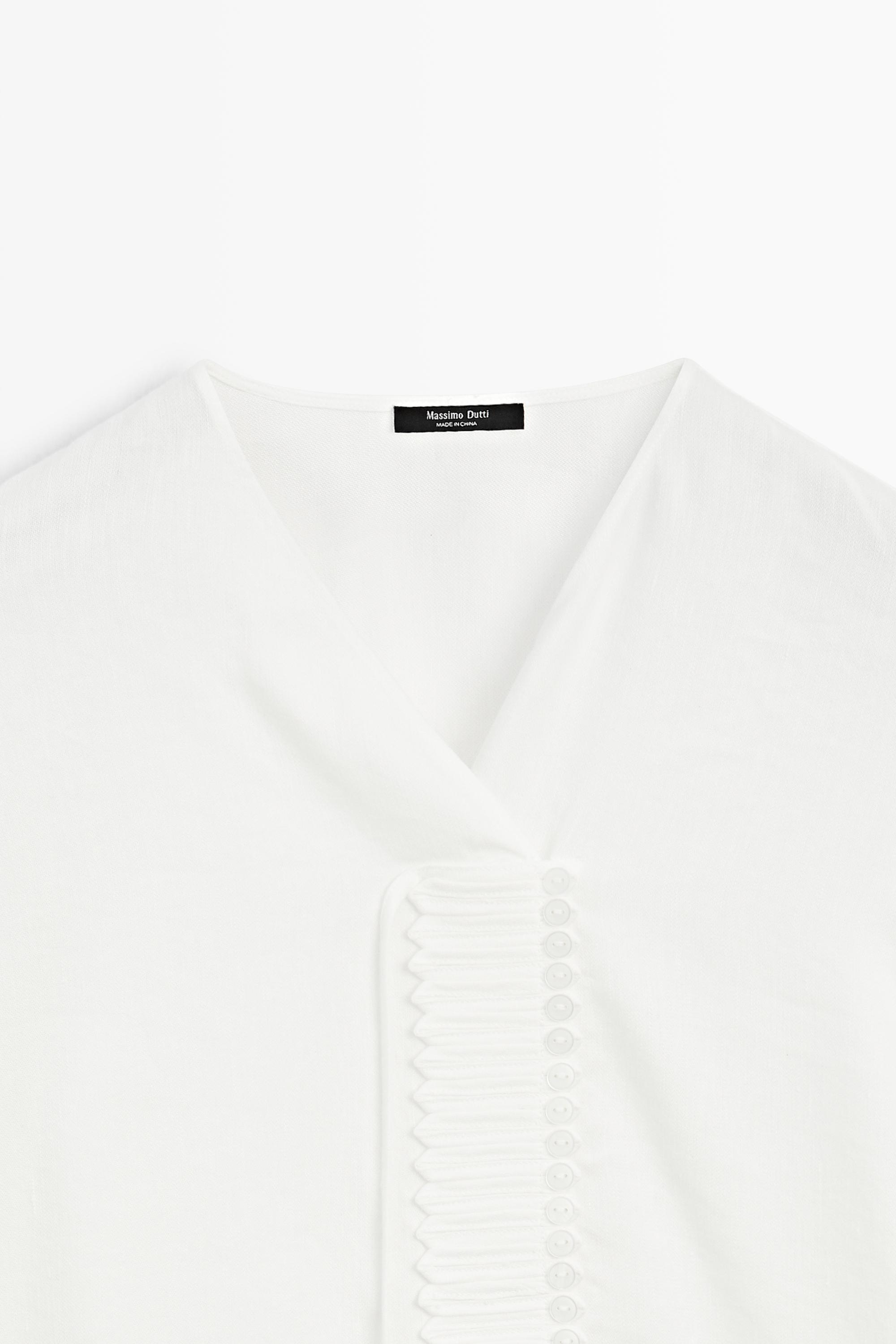 Flowing linen blend blouse with button detail