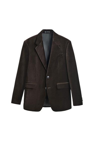 Dark brown velvet jacket with classic lapels and two front buttons, hanging on a white background.