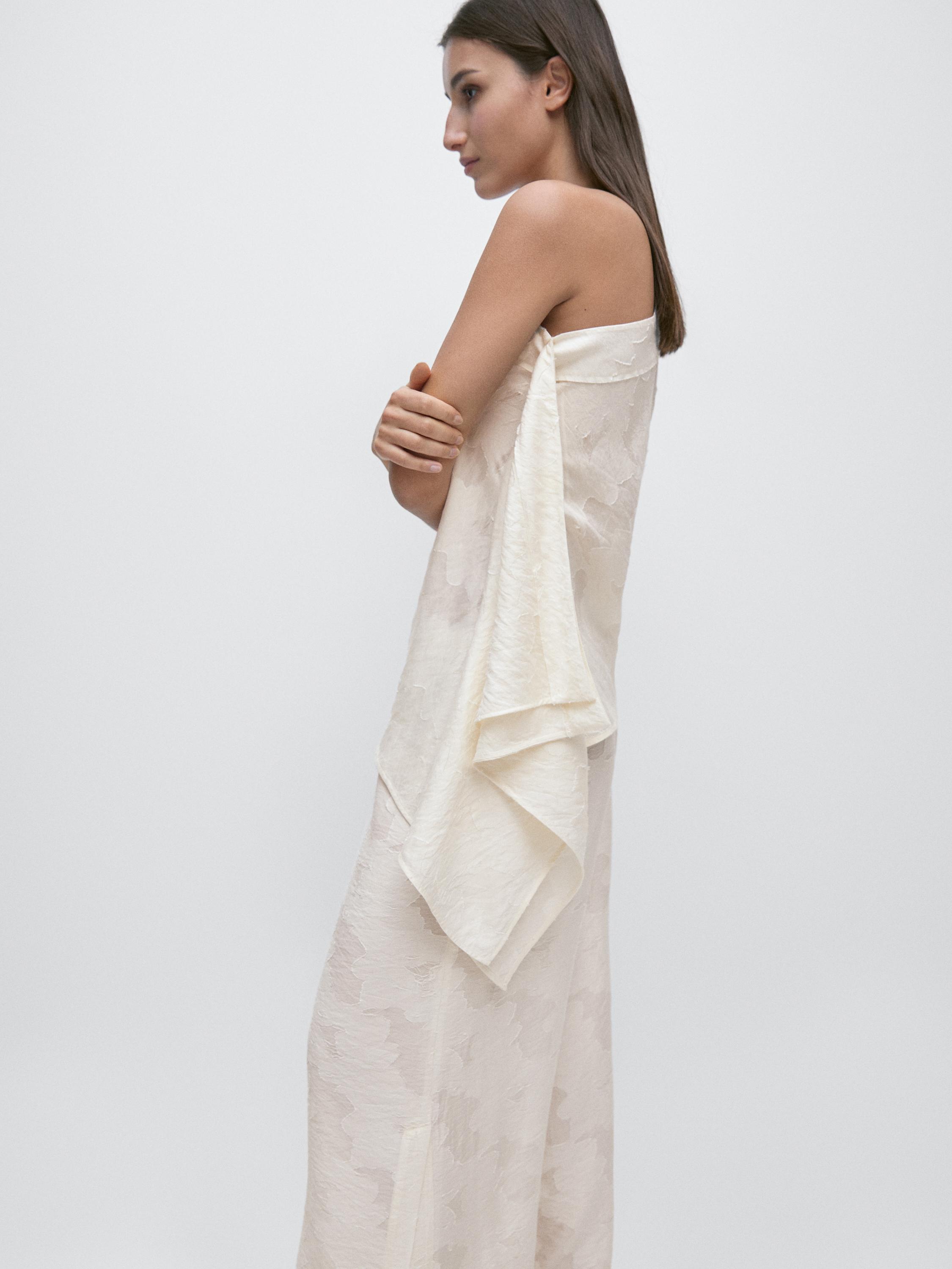 Top with asymmetric neckline