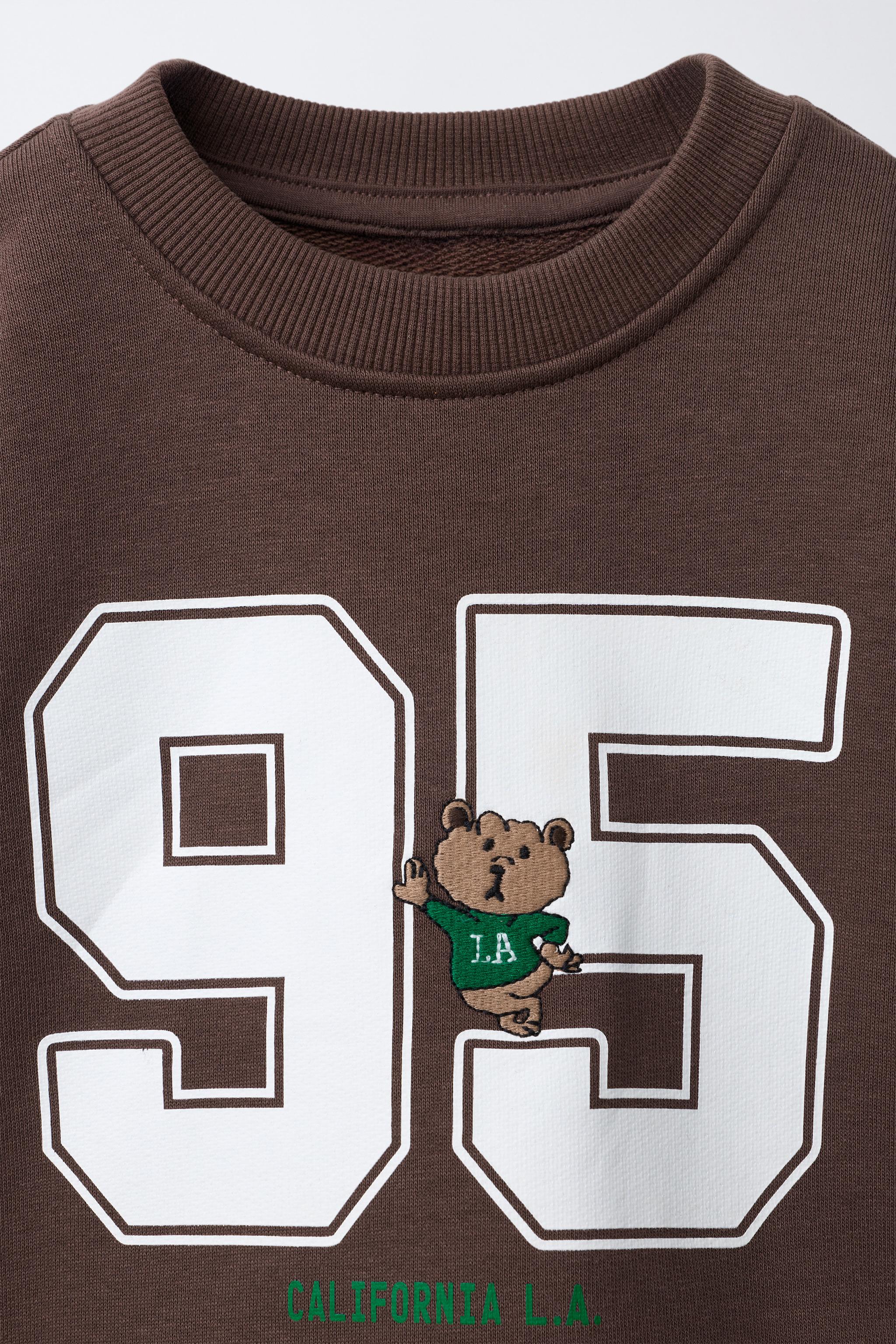 EMBROIDERED ANIMAL NUMBER SWEATSHIRT