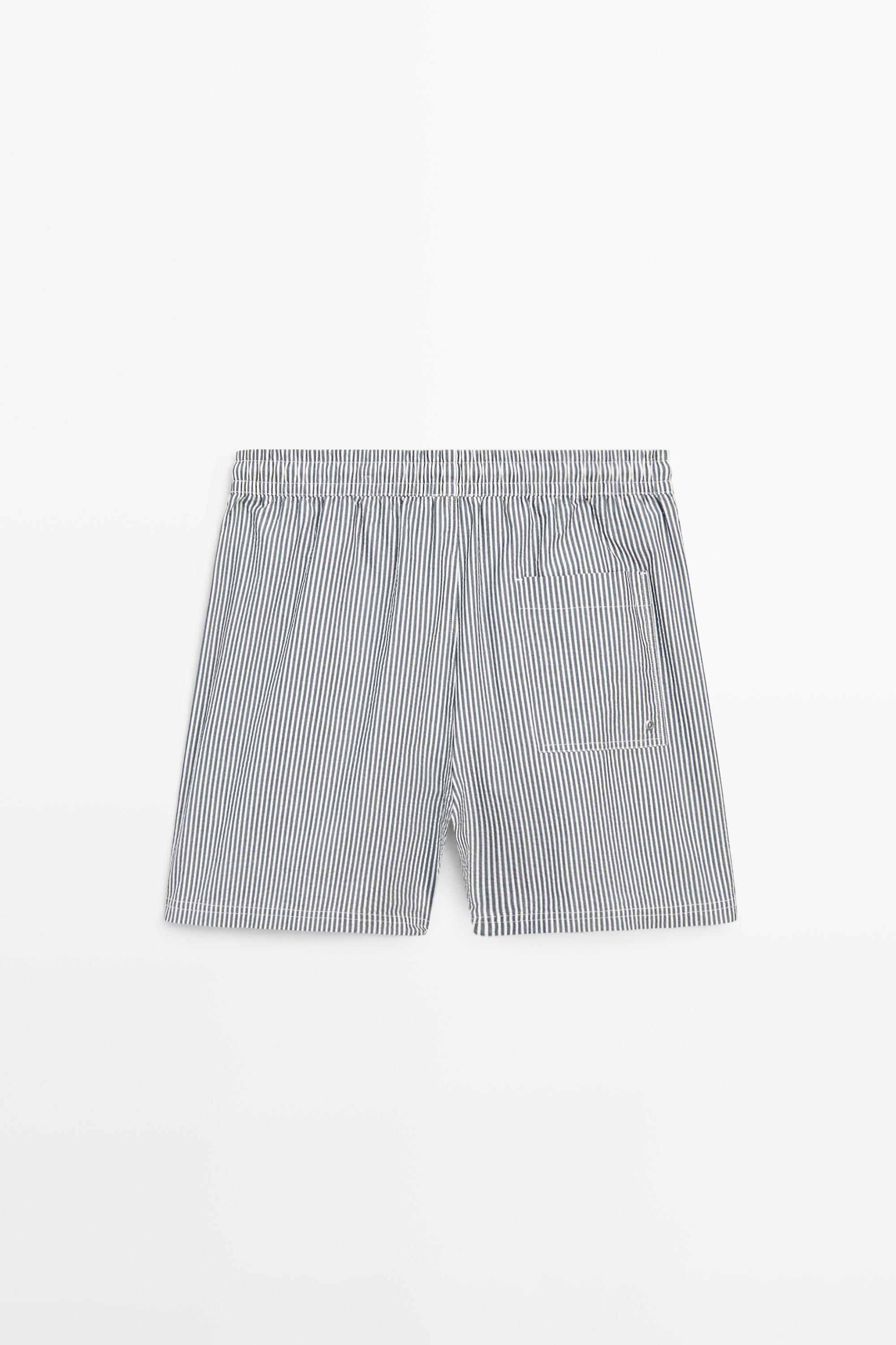 Swimming trunks with striped details