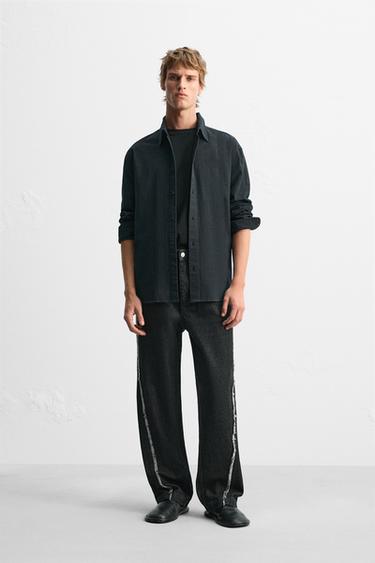 JEANS RELAXED FIT COSTURA DESFLECADA - Negro de Zara