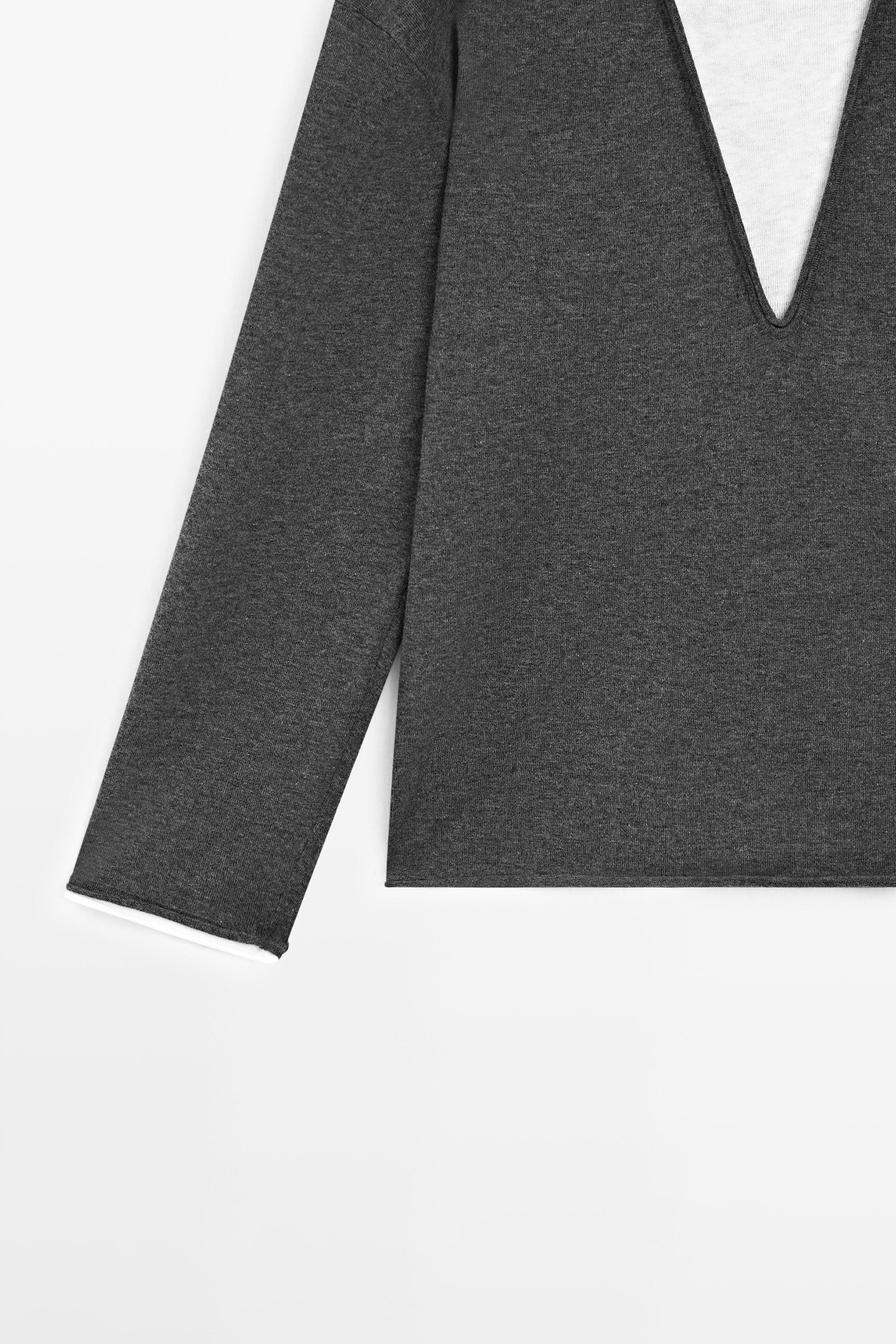 Cotton blend knit sweater with contrast fabric