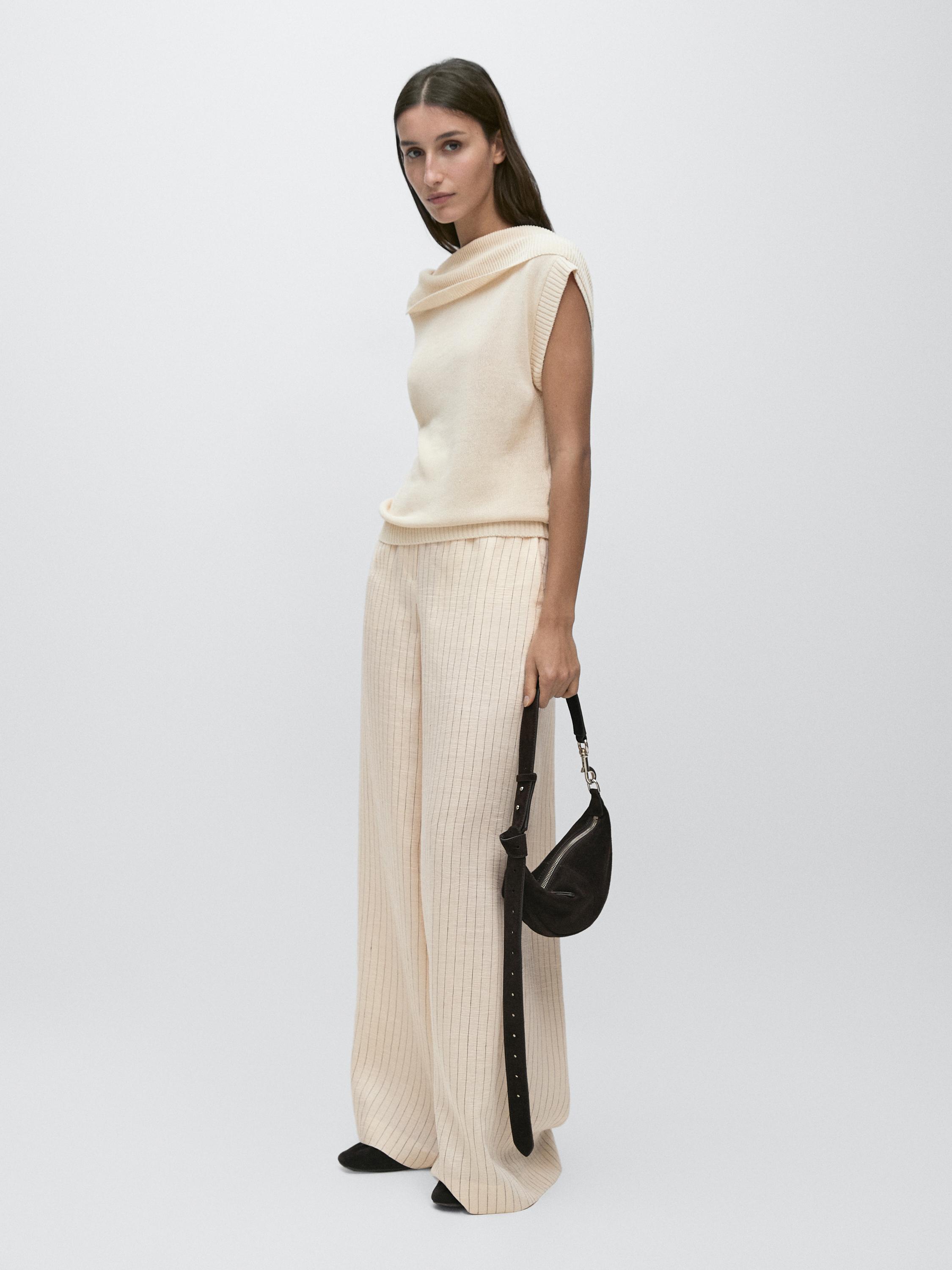 Knit sweater with low-cut back