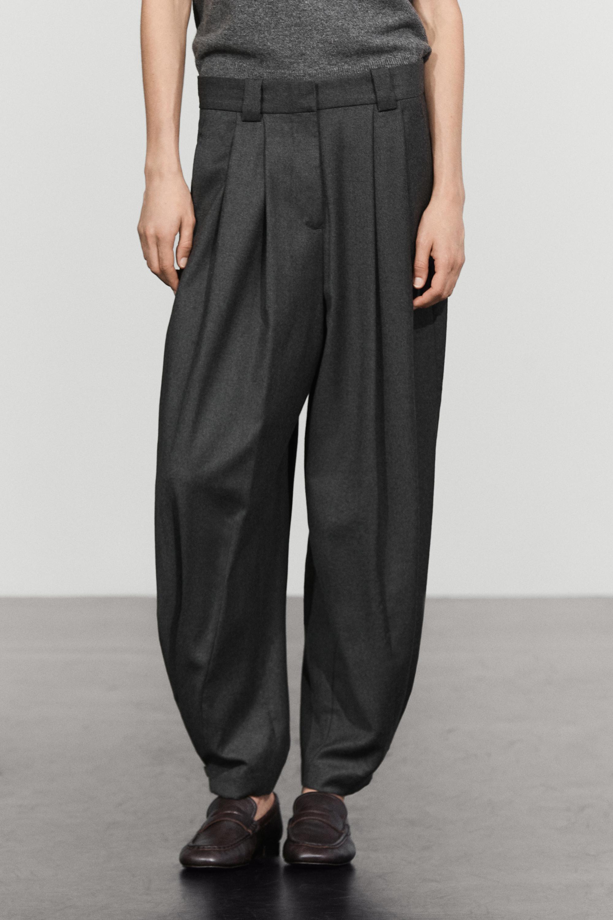 Pantalon flanelle à plis et détail bas