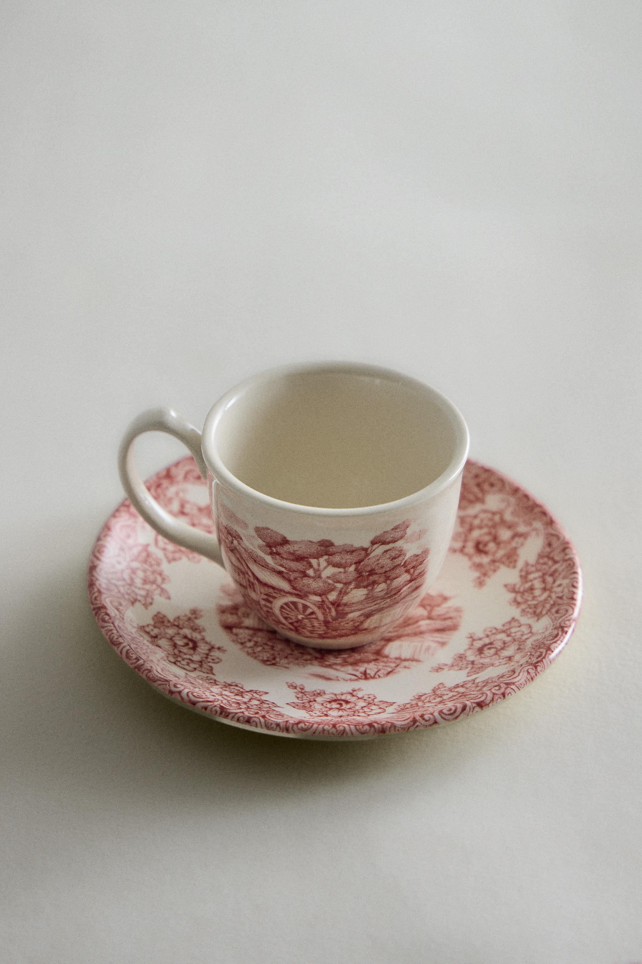 FLORAL AND LANDSCAPE EARTHENWARE COFFEE CUP AND SAUCER