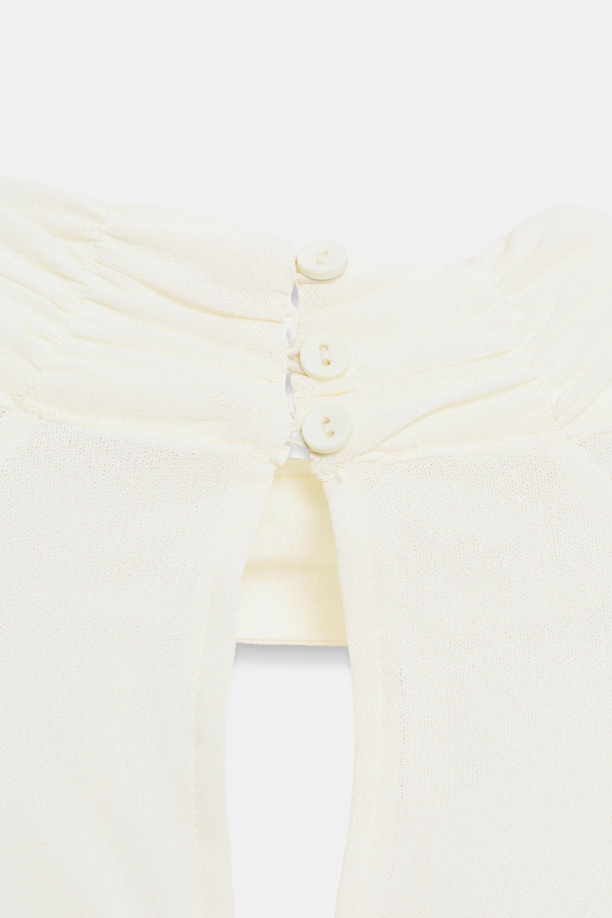 HIGH-NECK RUFFLE TOP