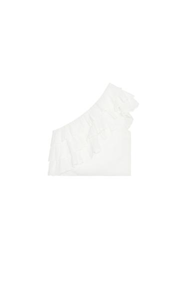 Front view of asymmetric white top with ruffles on one shoulder.