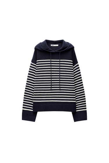 Front view of black and white striped hoodie with drawstrings and long sleeves.