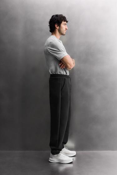 PANTALÓN TÉCNICO ZIPPER - Negro de Zara