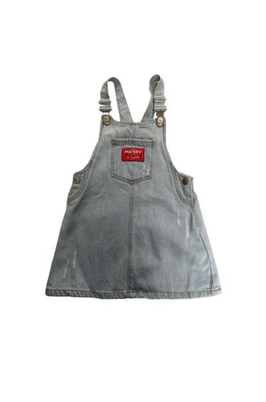Front view of light blue denim dungarees with 'Mickey' text on the front pocket.