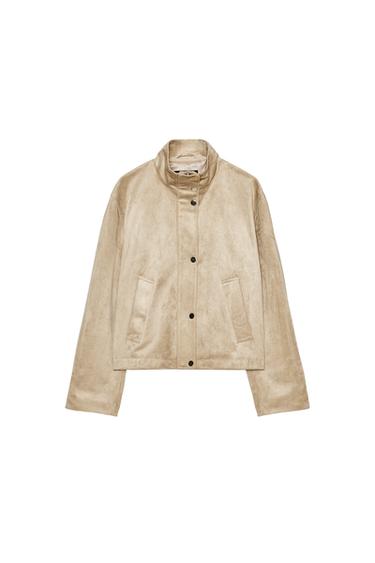 Front view of a beige jacket with side pockets and button fastening.