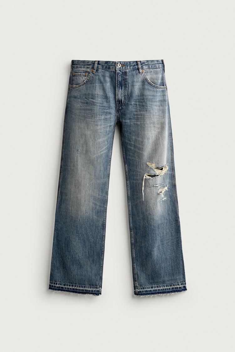 JEANS DE CINTURA BAJA CON ROTURAS Y PIERNA ACAMPANADA 6