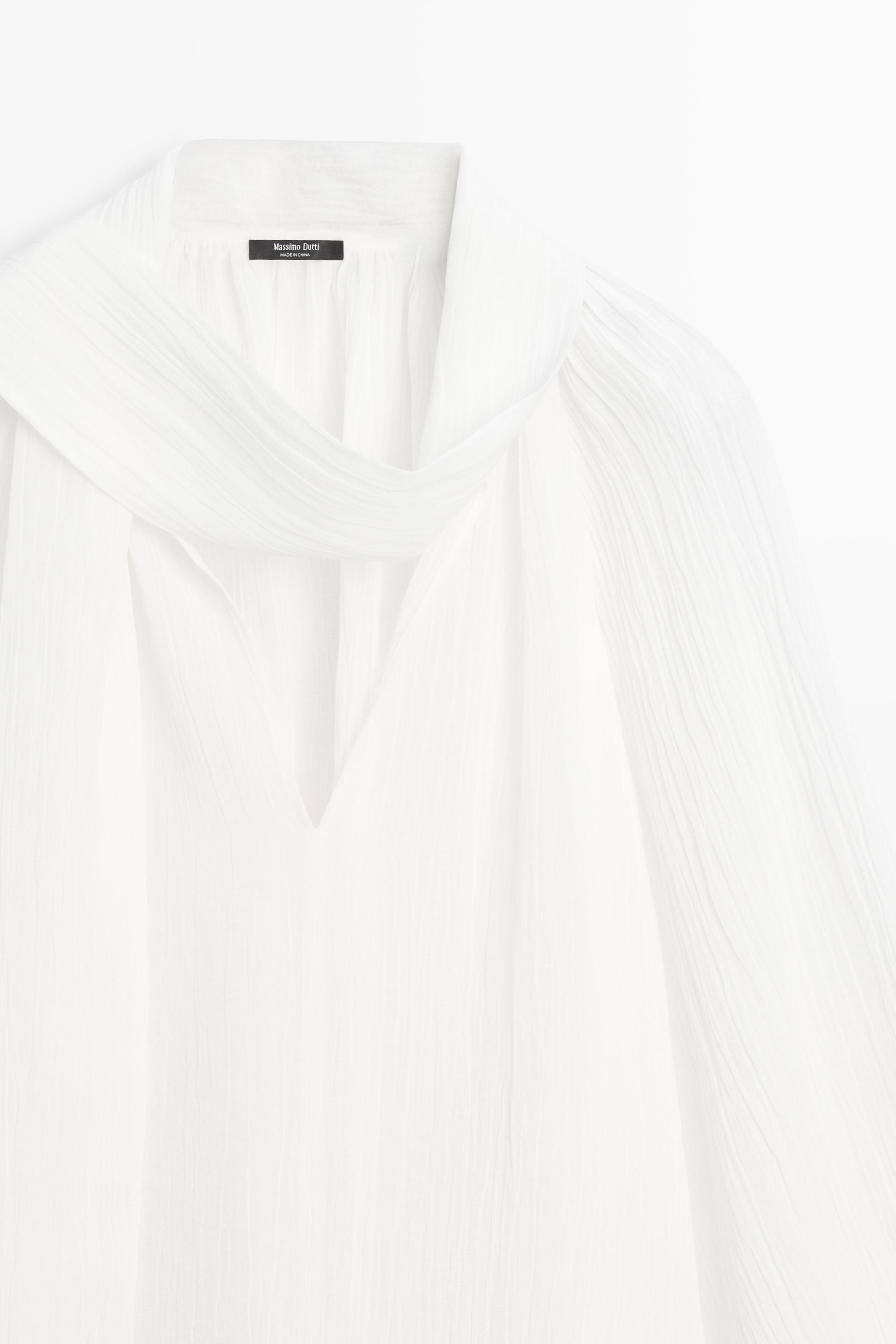 Blouse fluide col en V avec nœud
