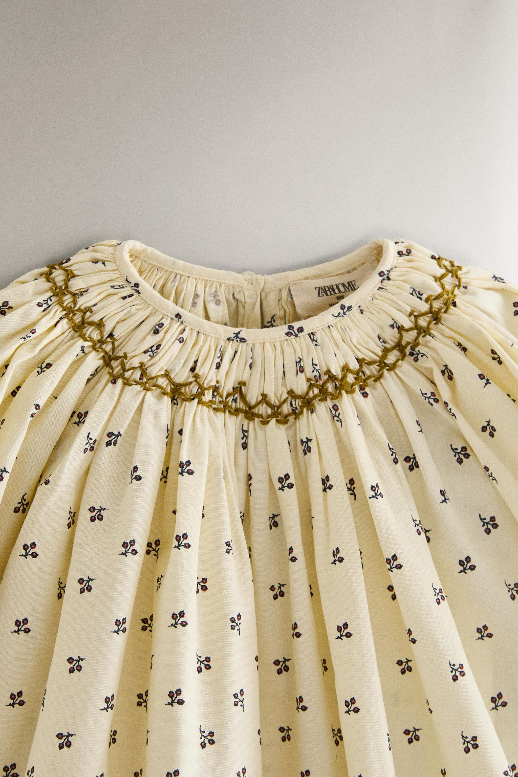 GATHERED FLORAL BABY ROMPER