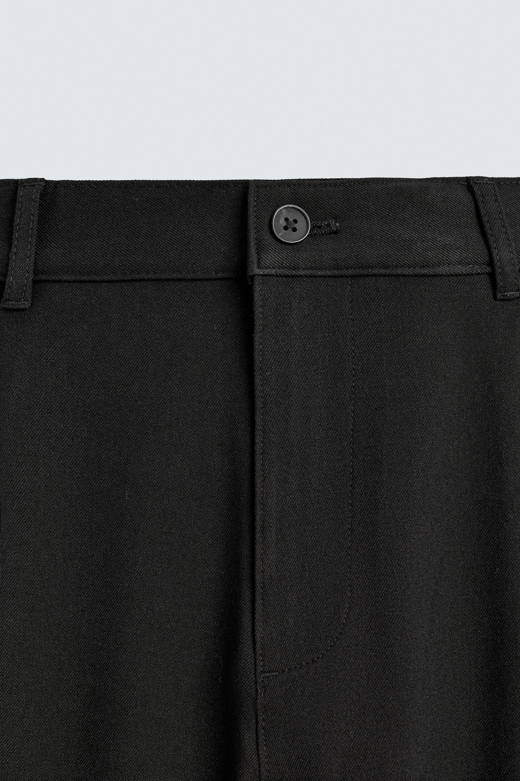 TEXTURED PLEATED PANTS