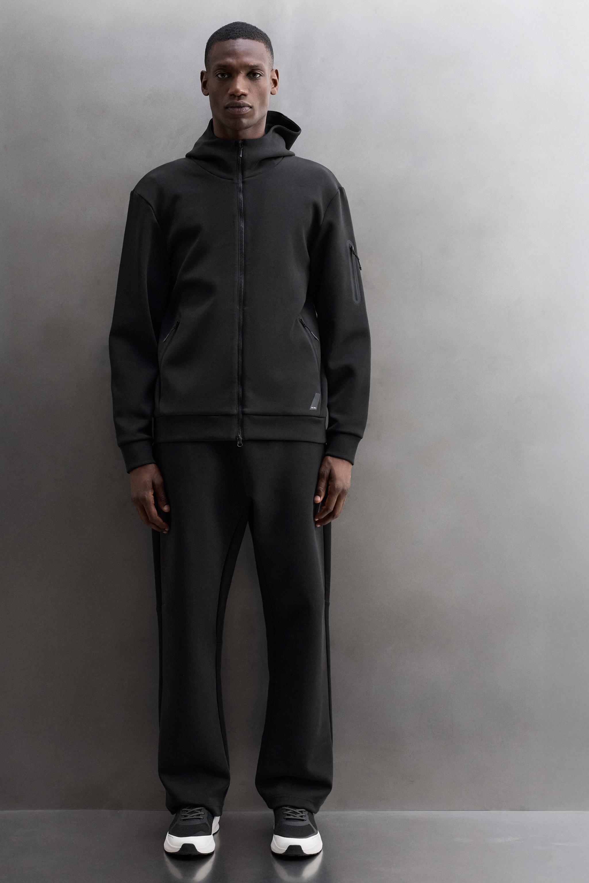 TECHNICAL ZIP-UP HOODIE