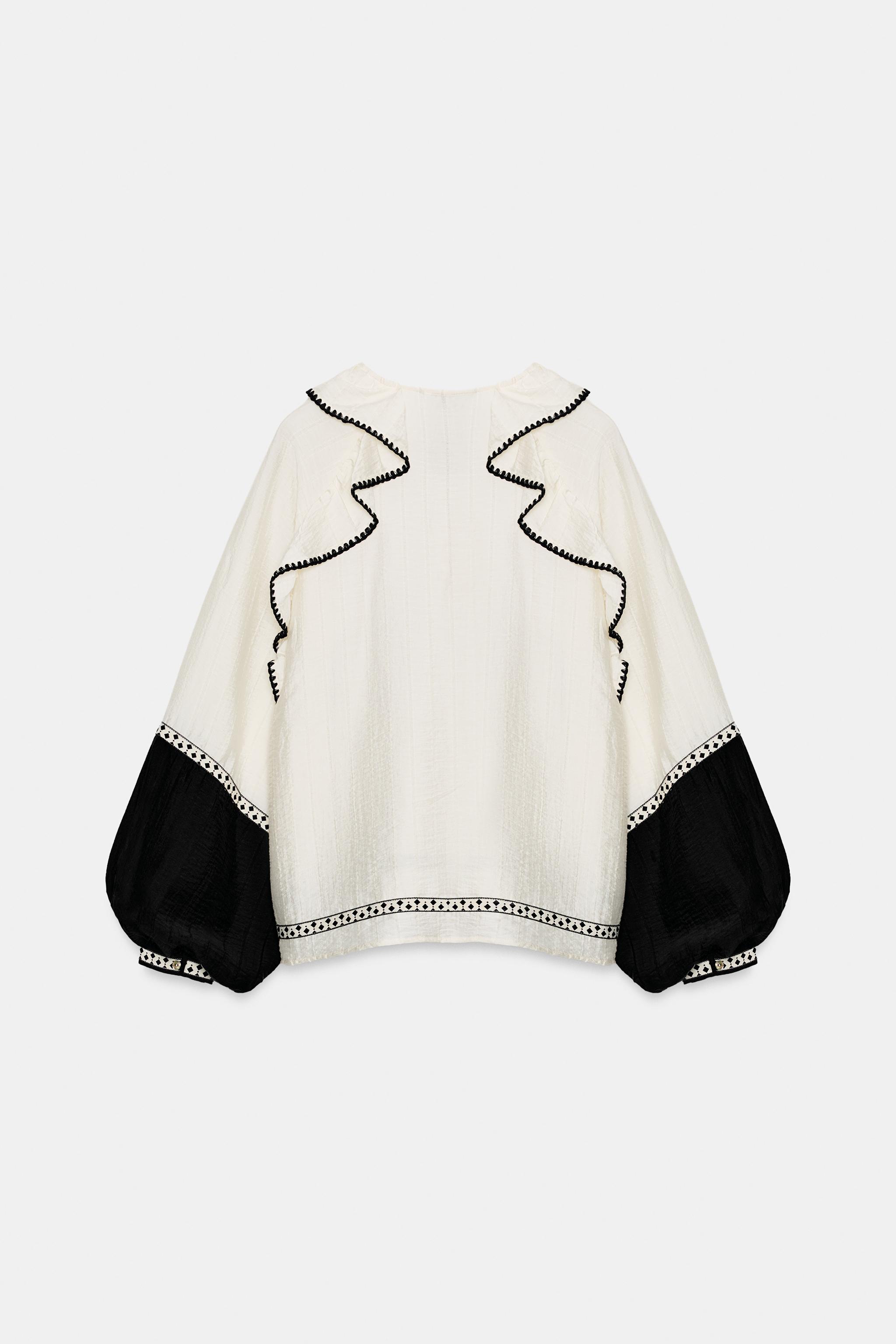 VOLUMINOUS RUFFLE BLOUSE