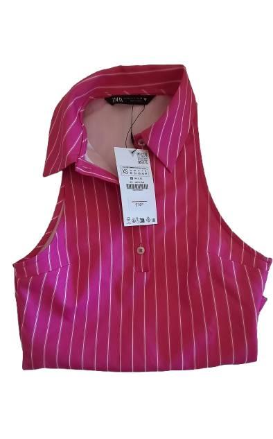 Pink sleeveless blouse with white stripes and a classic collar. Visible label with XS size details and a barcode.