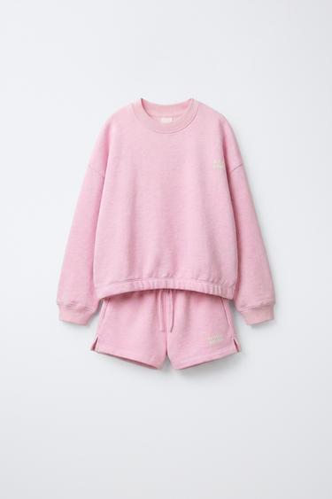 CONJUNTO SUDADERA Y BERMUDA TEXTO - Rosa vigoré de Zara