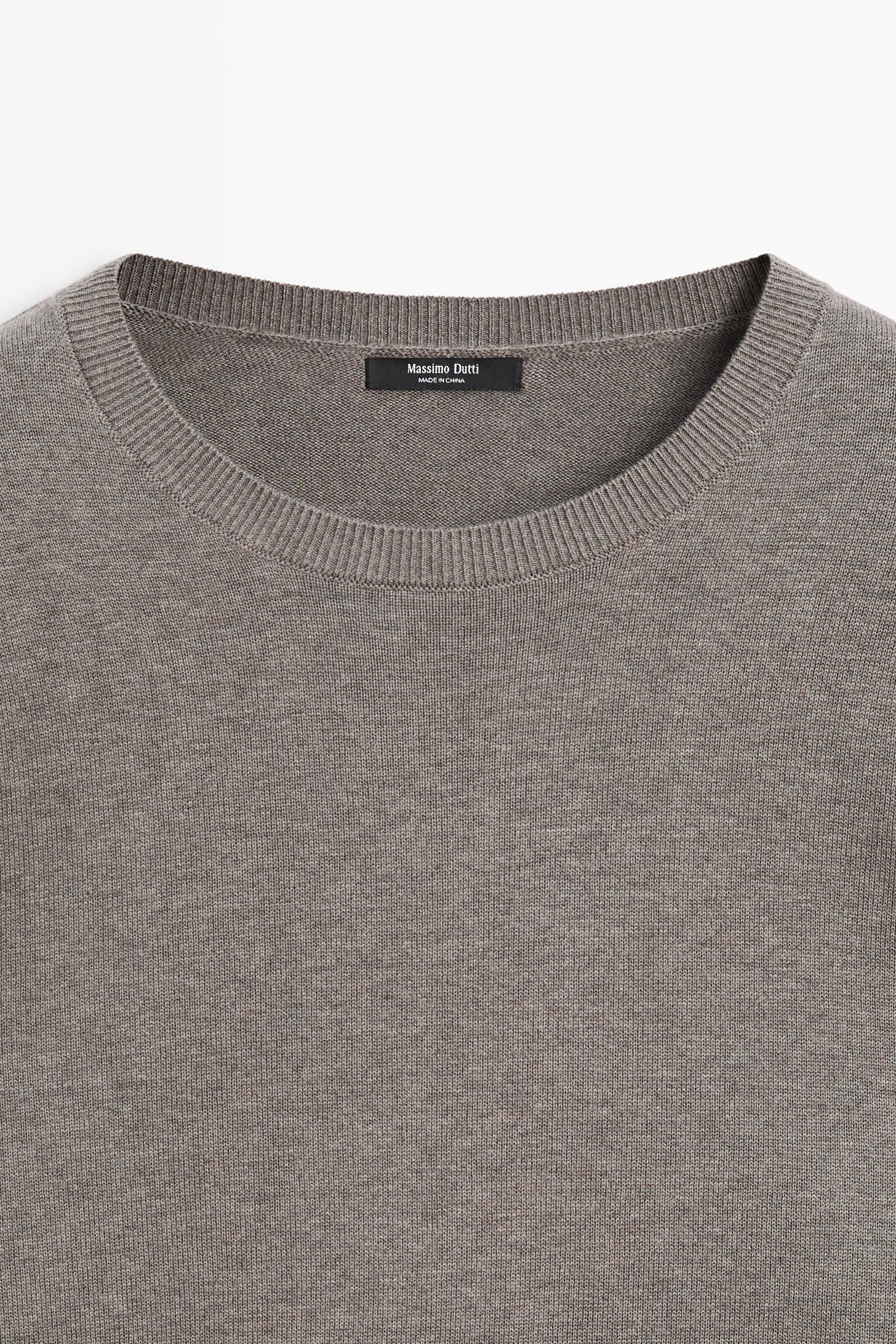 Oversize knit sweater with double sleeve detail
