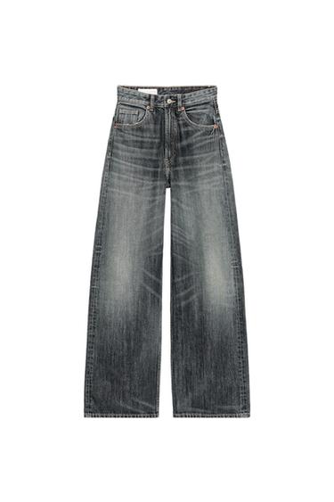 Front view of grey wide-leg jeans with a distressed effect, front and back pockets, button and zip fastening.