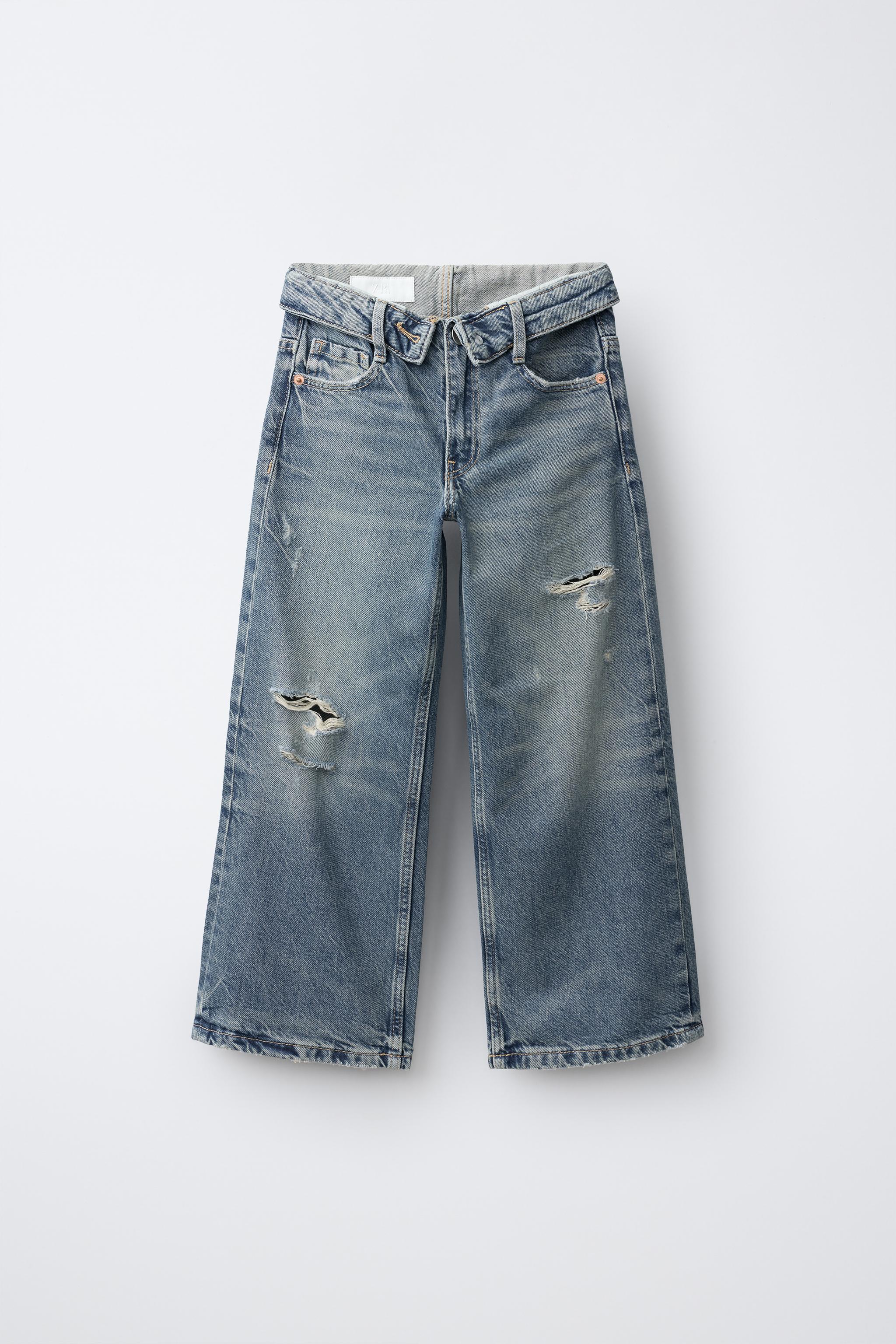 JEAN À JAMBES LARGES DÉCHIRÉ