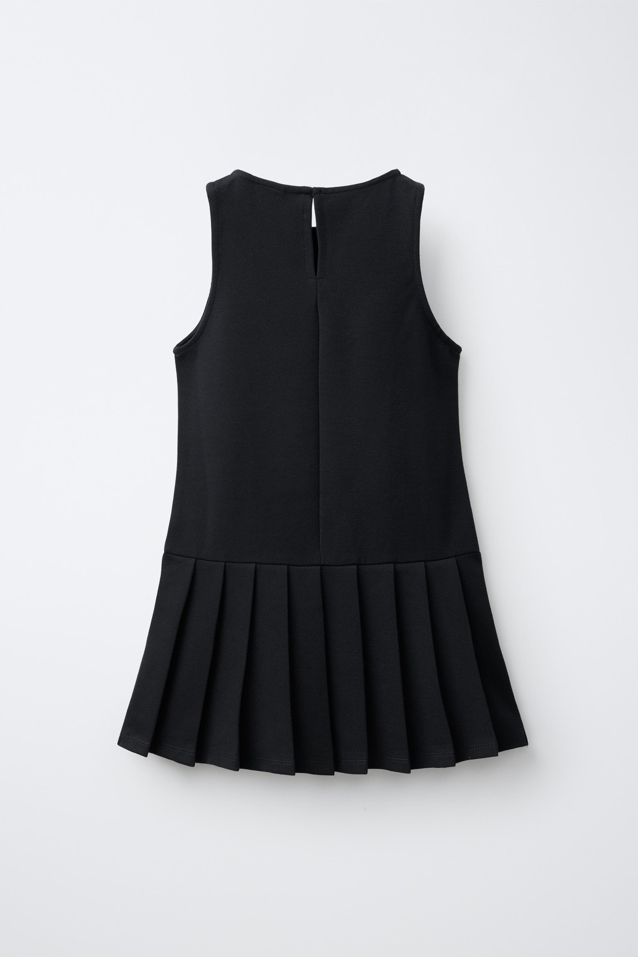 ROBE-SALOPETTE À PLIS