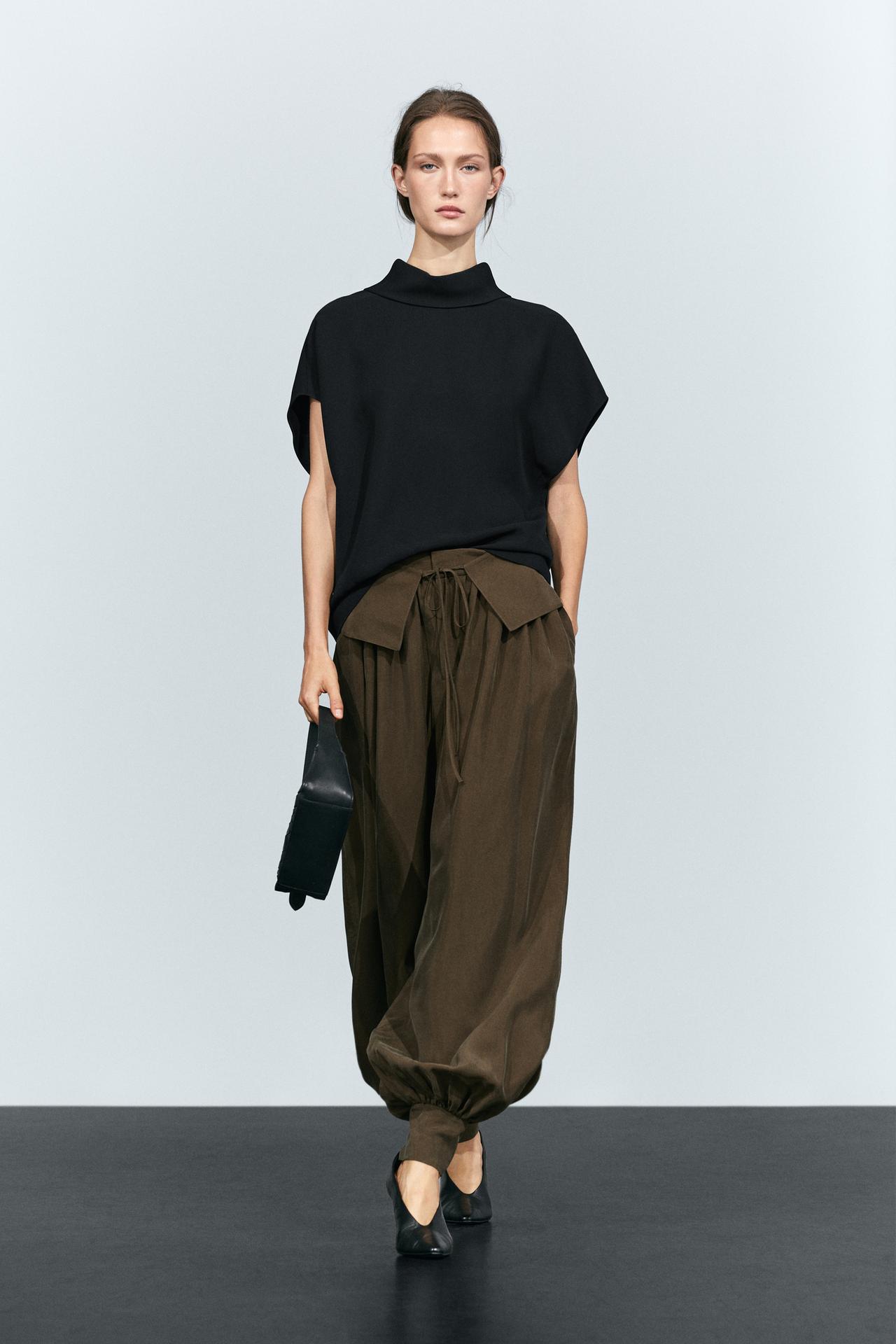 Sleeveless roll neck top — Black