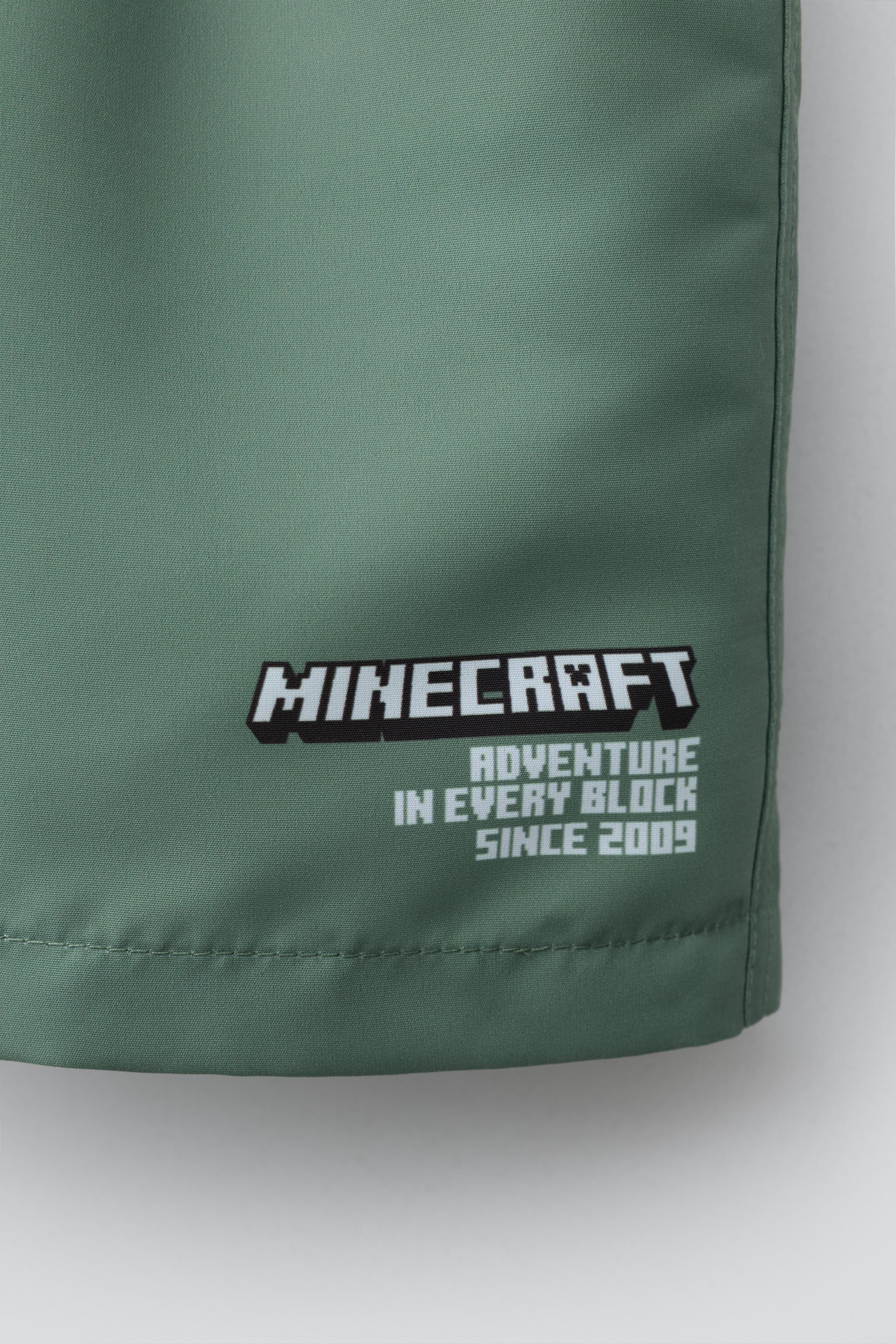 AGES 6-14 / MINECRAFT © MOJANG AB. ™ SWIM SHORTS