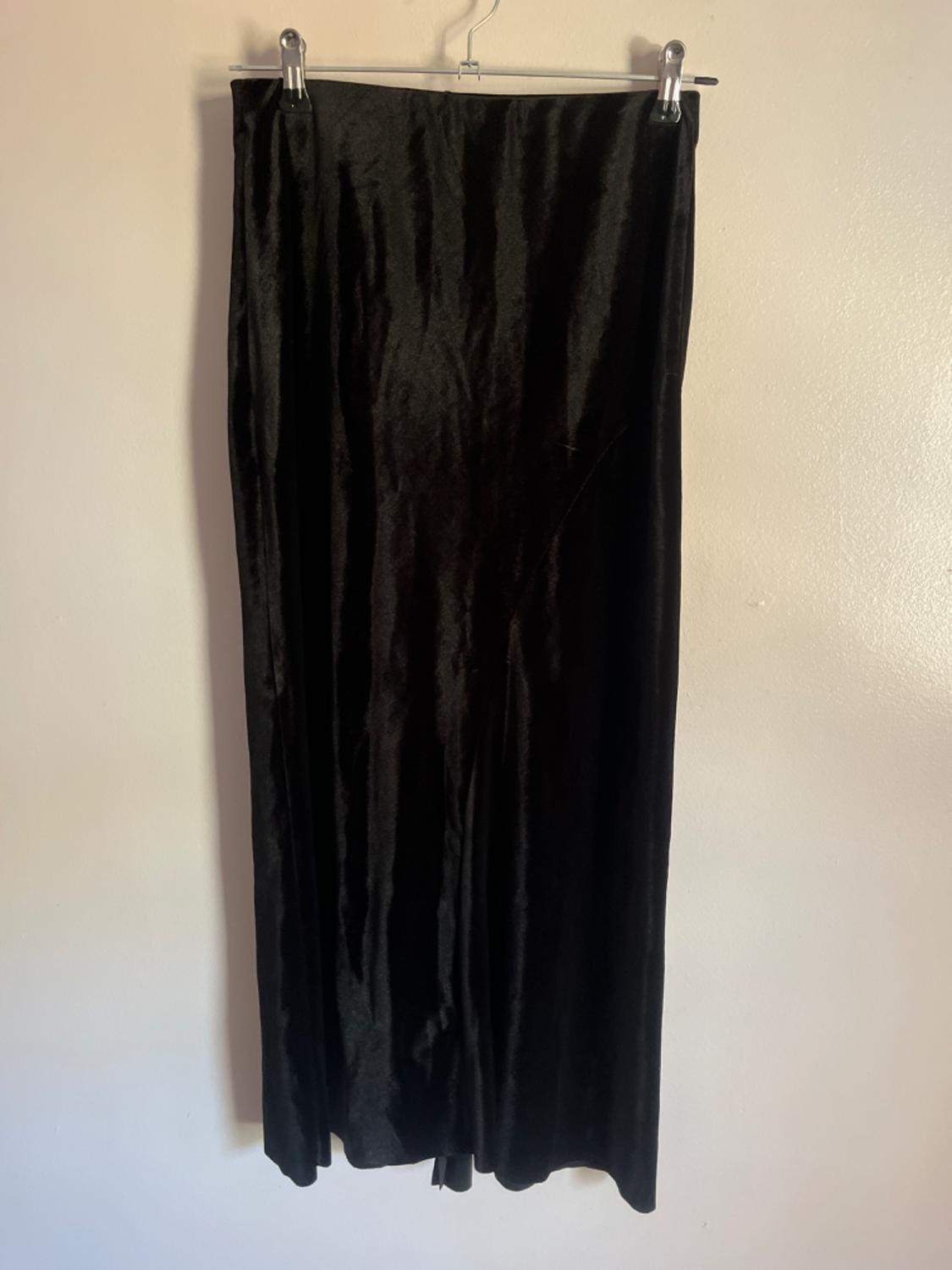 Front view of a long black skirt with a straight fall.