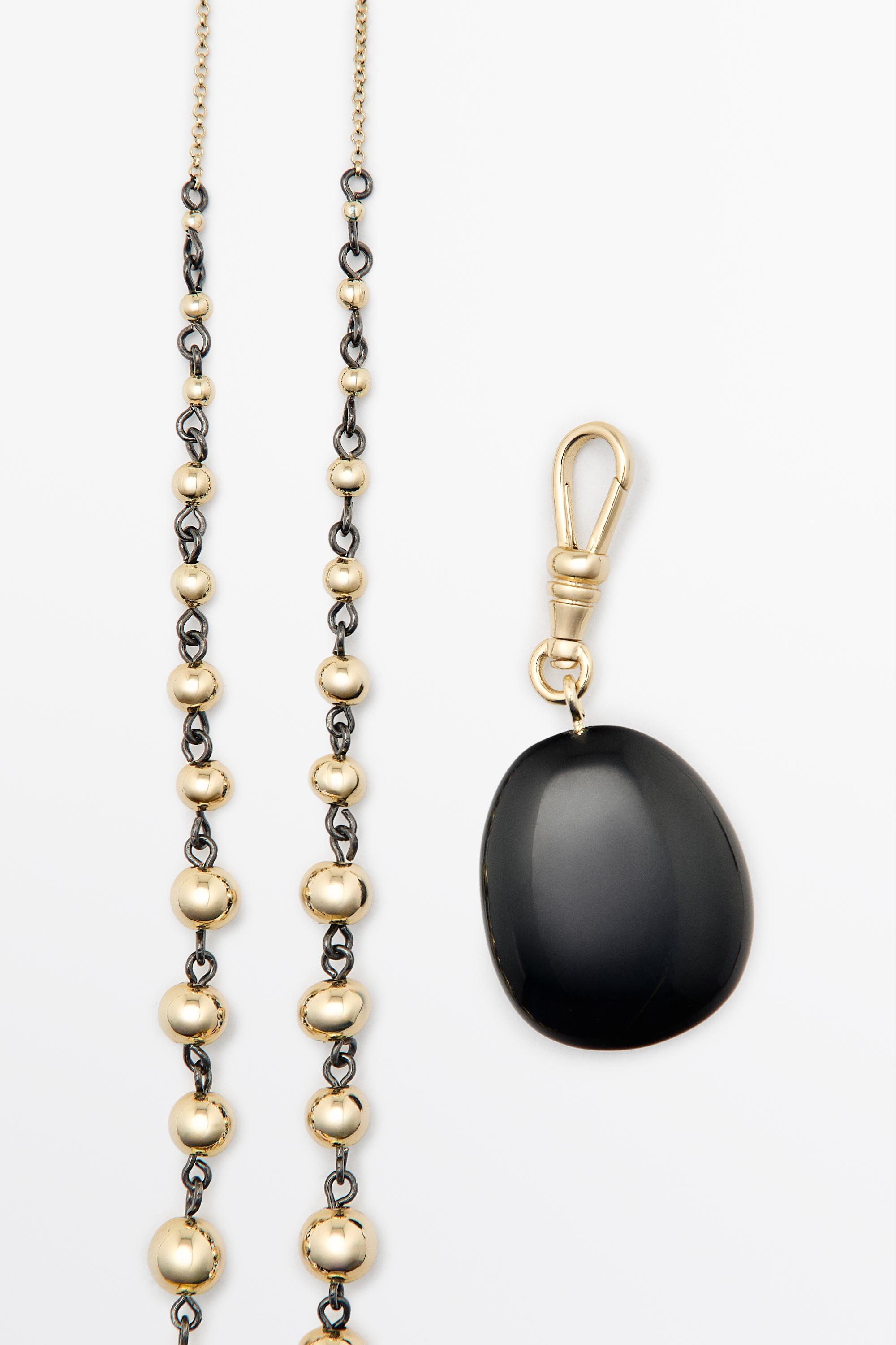 Collier chaîne à billes et onyx