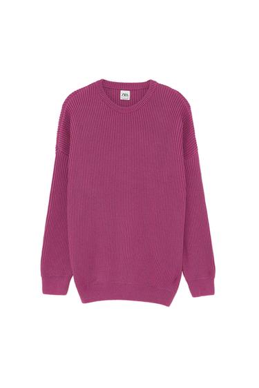 Fuchsia knitted jumper with round neck and long sleeves. Visible label with text "ZARA KNIT". White background.