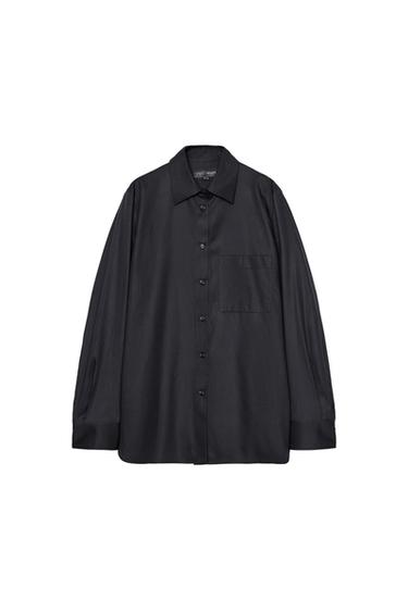 Front view of black shirt with front pocket and full button closure.