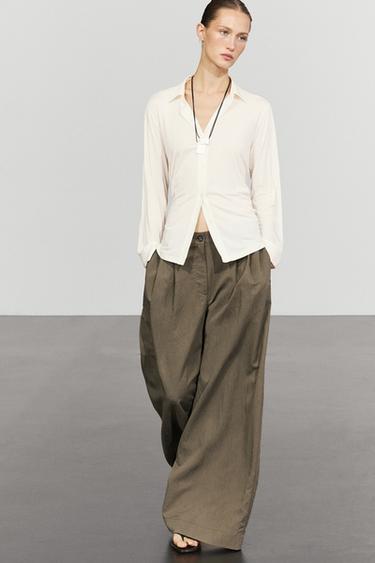 Technical wide-leg pleated pants — Black gold 1