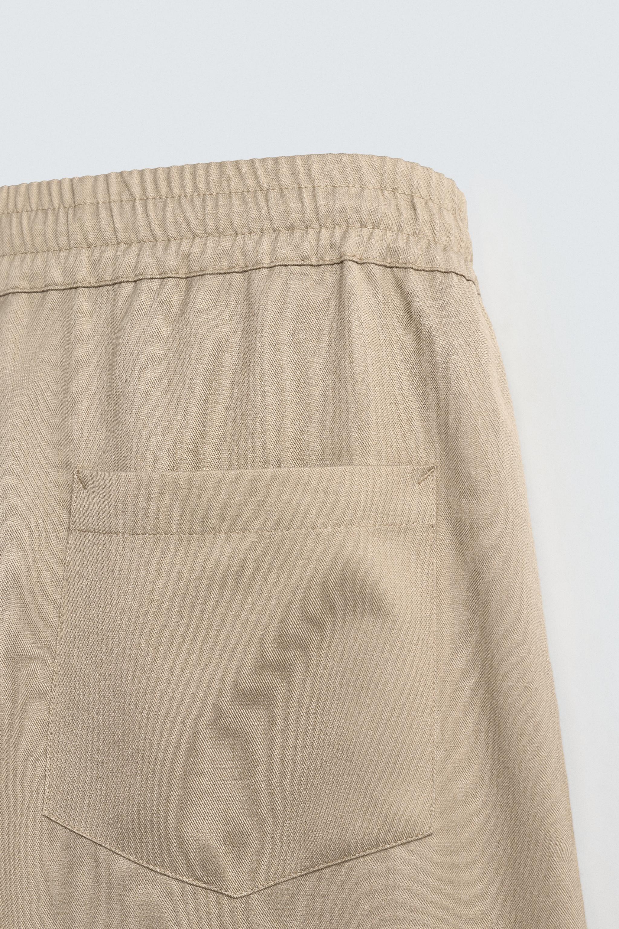 PLEATED BALLOON FIT PANTS