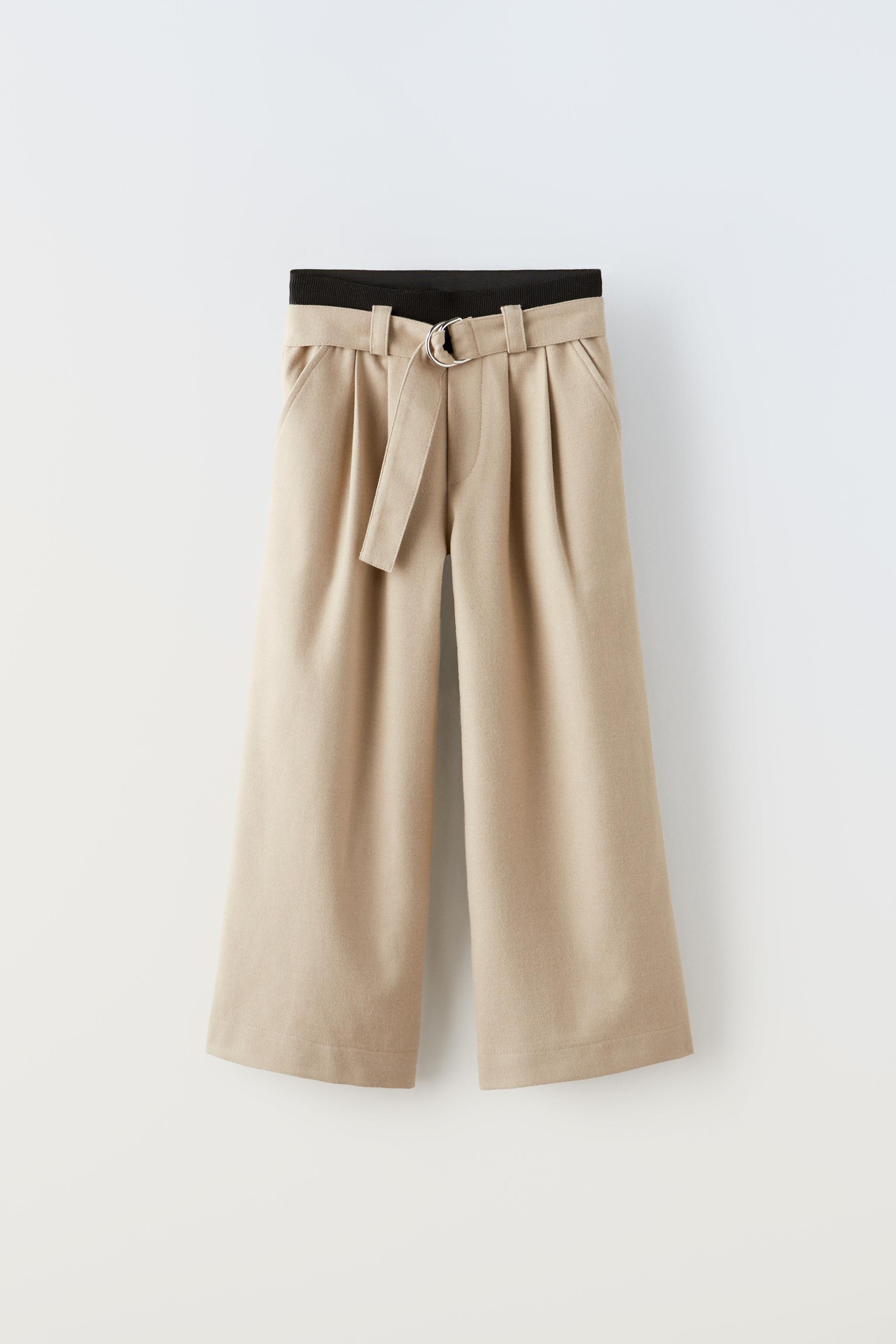 High-waisted ecru linen pants with darts