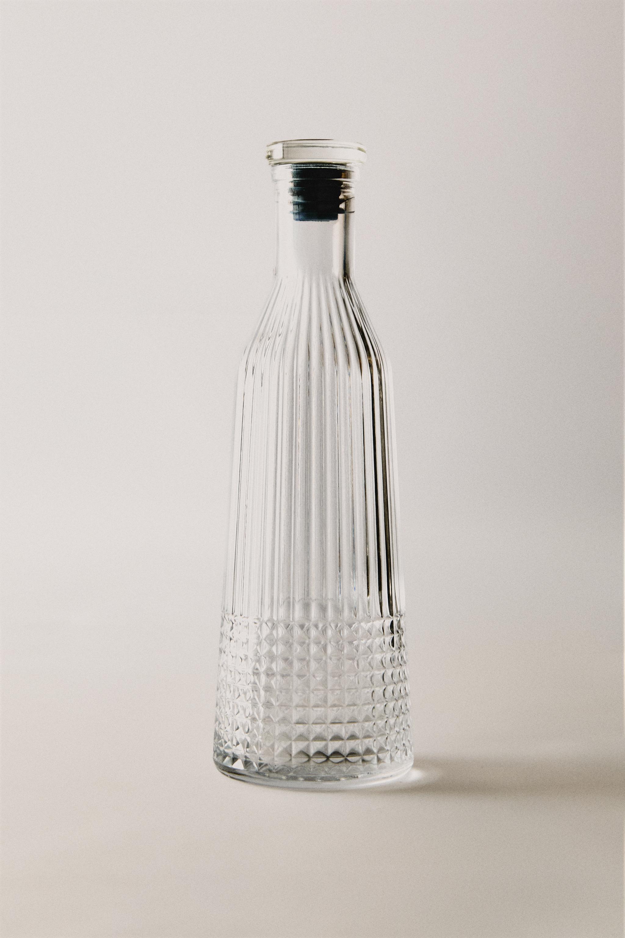 RAISED DESIGN GLASS BOTTLE — Transparent