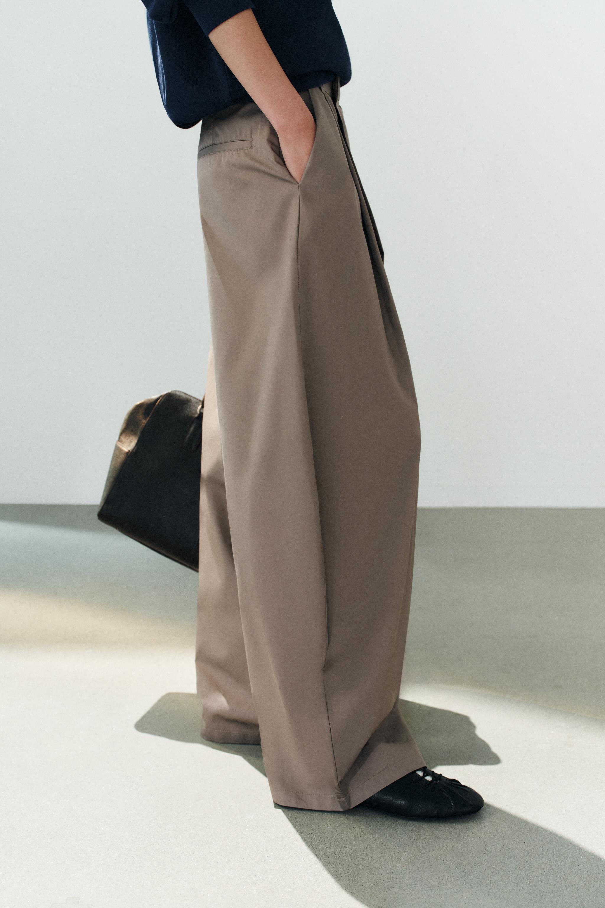 ASYMMETRIC WAIST PLEATED TROUSERS
